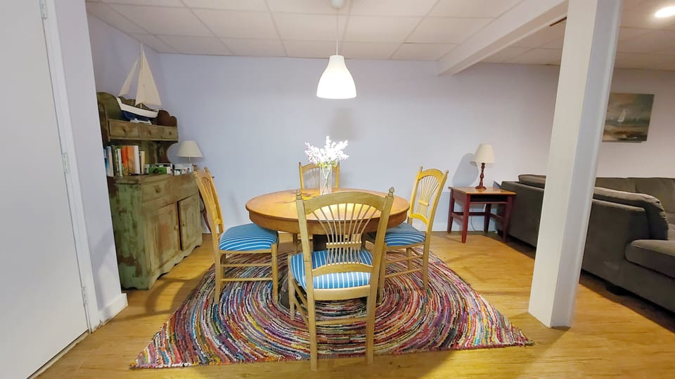 Lower level family room has a table for games and puzzles