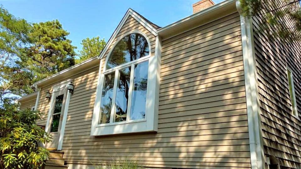 House is set on a wooded lot