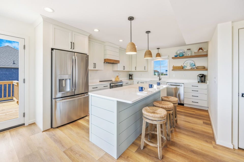 Pull up a stool to the kitchen's 3-person breakfast bar for a quick cup of coffee or to watch your group's chef work their magic.