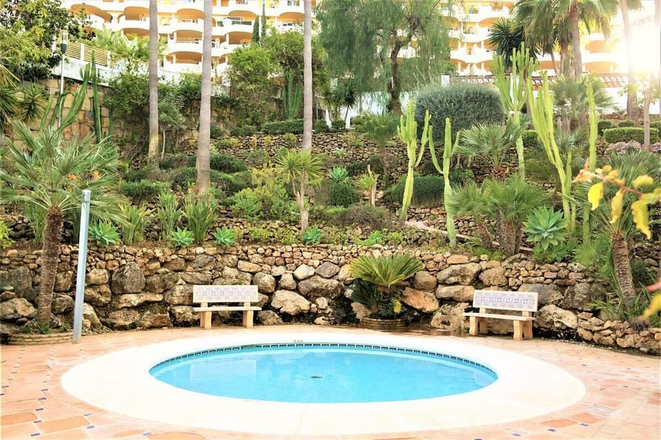 View of the children separate pool surrounded by gardens