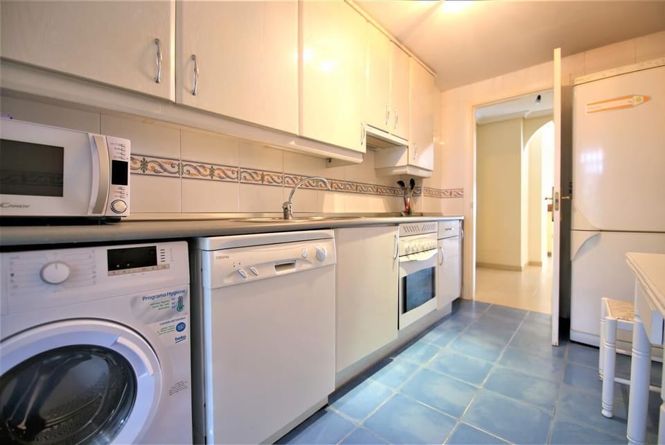 Another view of the kitchen with breakfast table for two