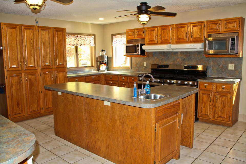 Large coffee maker, 2 microwaves, 2 fridges, and 2 gas ranges.  