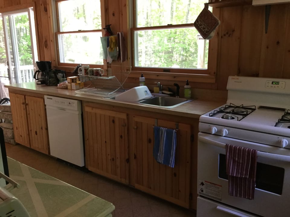 Kitchen looking out over the deck and back cove