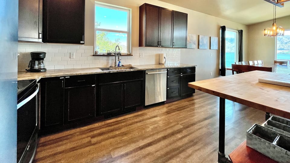 Kitchen with granite countertops and butcher-block island