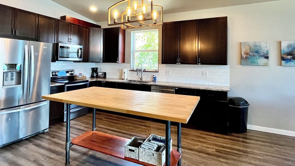 Kitchen with granite countertops and butcher-block island
