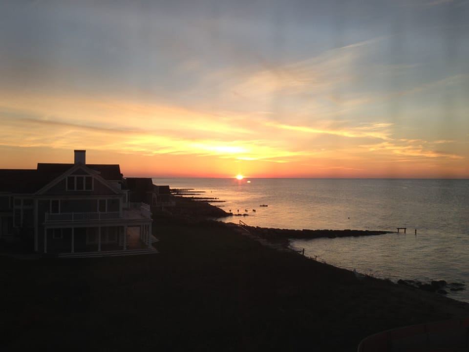 Sun rising over ocean from third floor