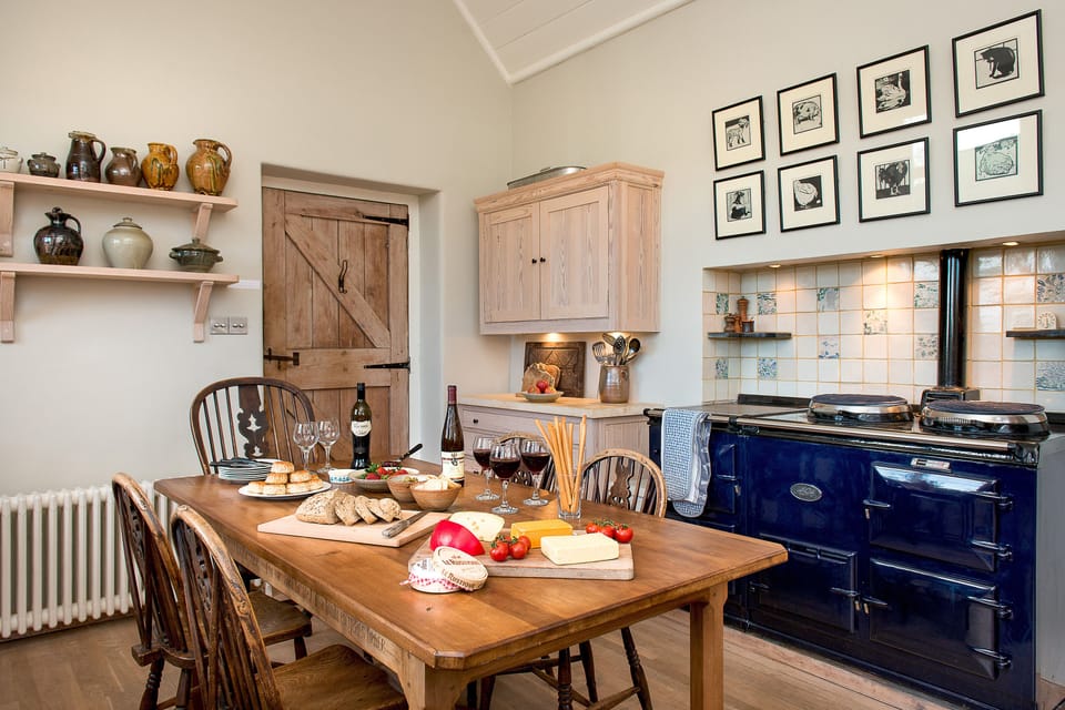 Kitchen space with aga, cooker, fridge and dishwasher