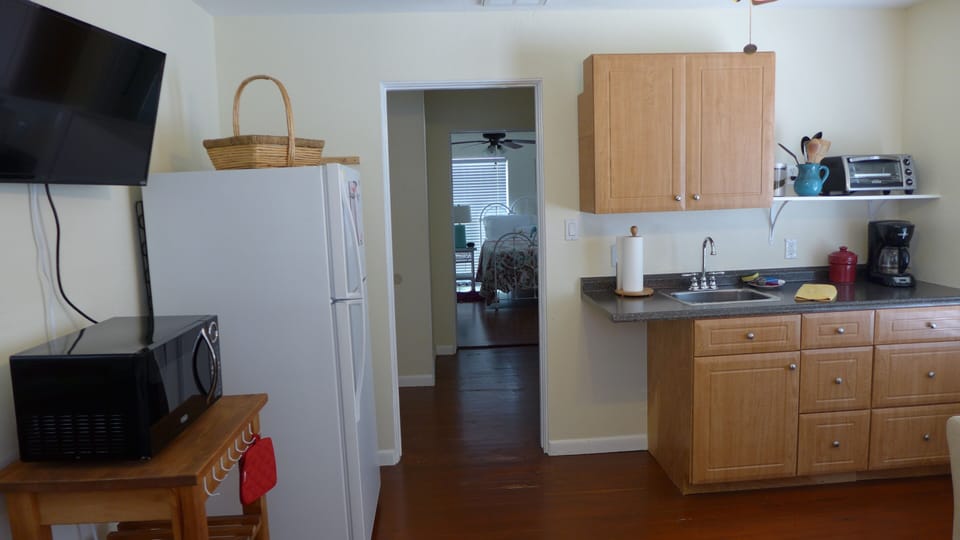 Microwave, toaster oven, induction plate cooktop, coffee maker, all dishes, etc.