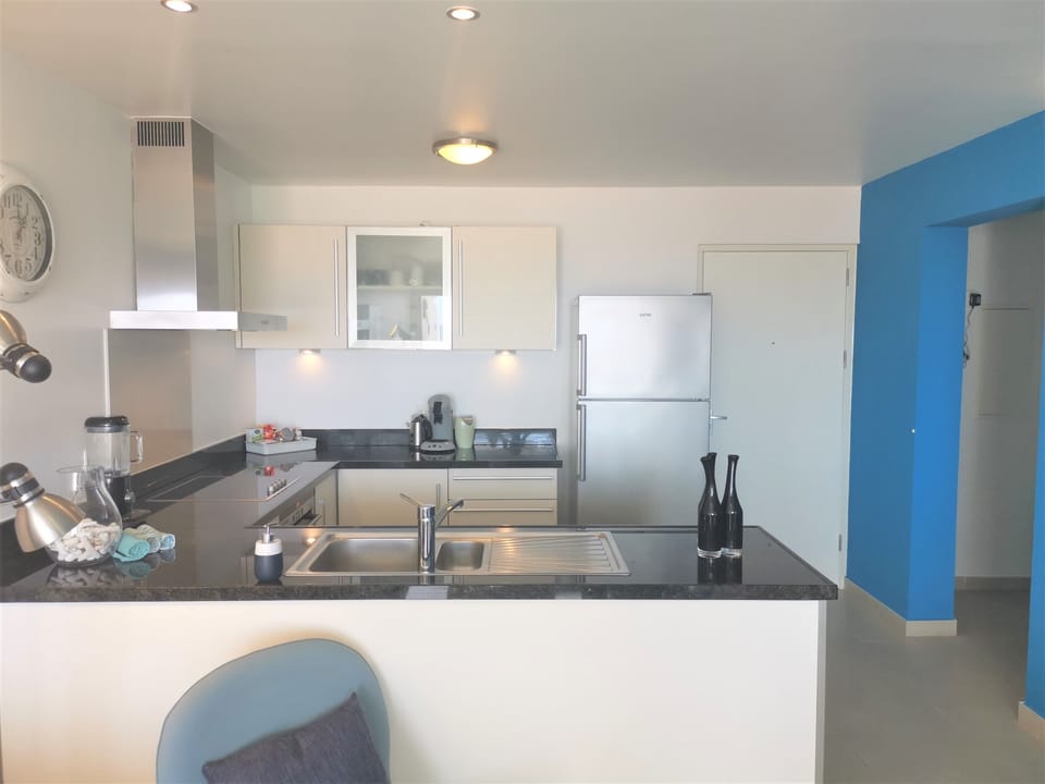 the living room with open kitchen