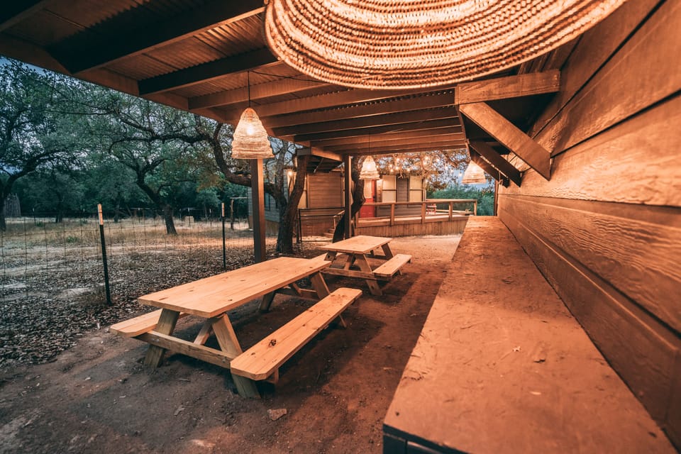 OUTDOOR DINING: 2 Picnic tables and charcoal grill