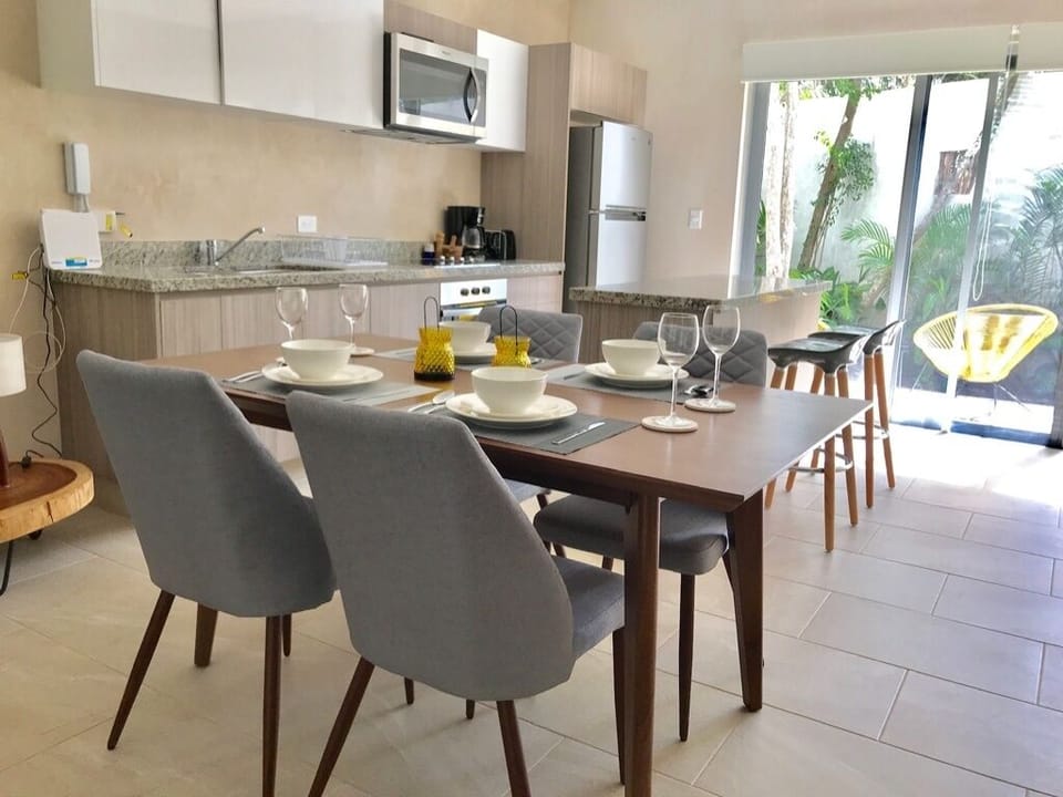 Fully equipped kitchen with electric oven and stove.