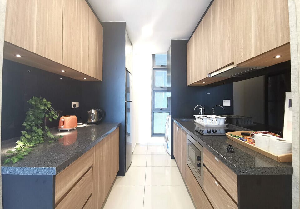 Kitchen with stove, microwave, washer etc
