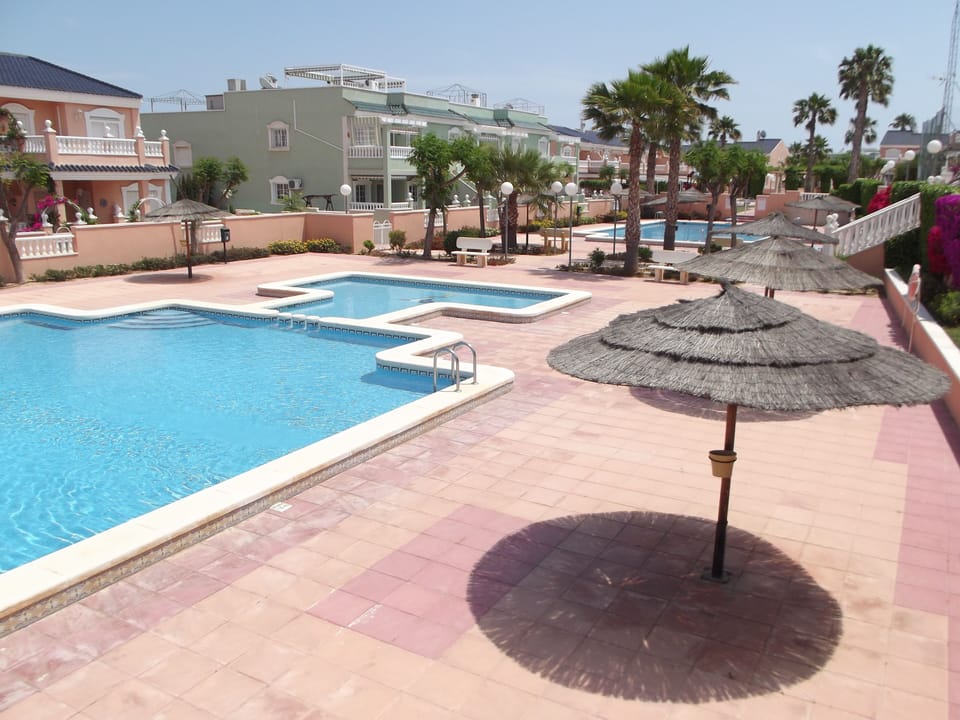 Pool area (children's pool in foreground) with our apartment in the background