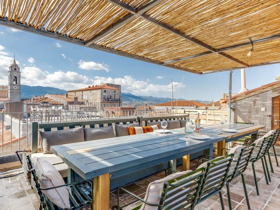 Sky, Cloud, Daytime, Building, Property, Window, Table, Shade, Wood, Chair