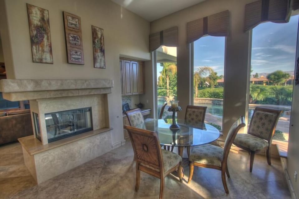 Kitchen nook features a 3-sided fireplace.