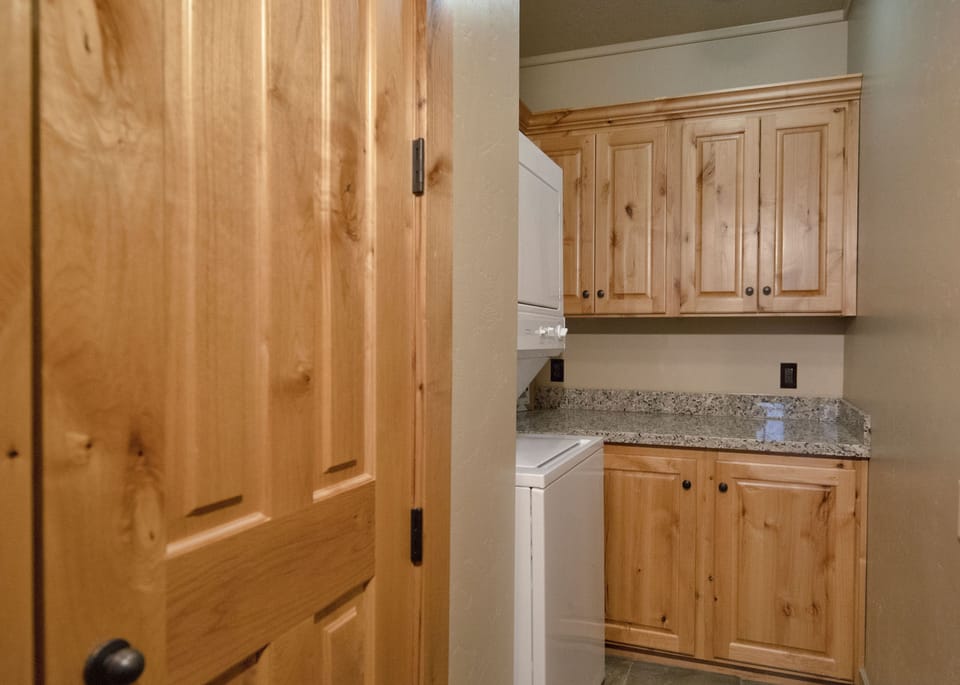 Step into your own cozy mountain retreat where warm knotty pine cabinets and granite counters create the perfect space for your morning coffee or evening snacks.