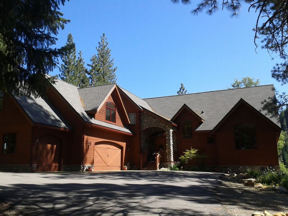 The studio rental is above the 3 car garage on the left of photo. 