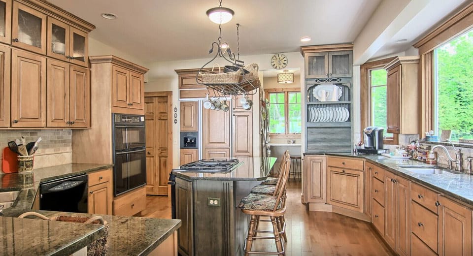 Spacious and well-equipped kitchen with views to the beach and lake. 
