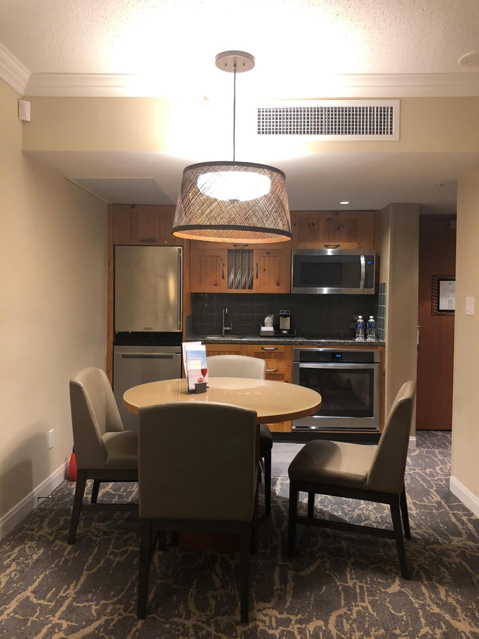 Seating area and kitchen in background