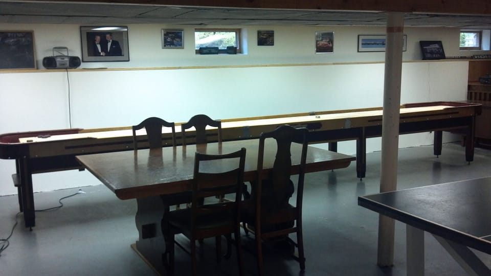 basement gameroom with card table,bar, shuffleboard,pinball,pingpong,foosball