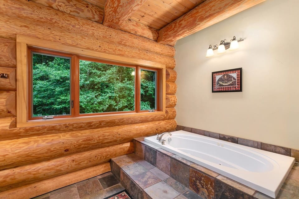 Downstairs master bath with jetted tub.