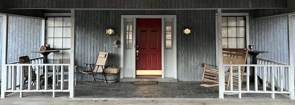 Front door and porch; provides lake view.