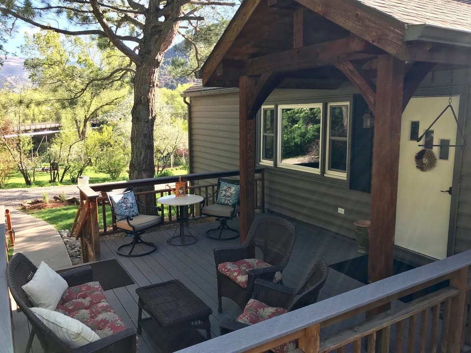 Large deck/yard with beautiful view of yard to Roaring Fork River!