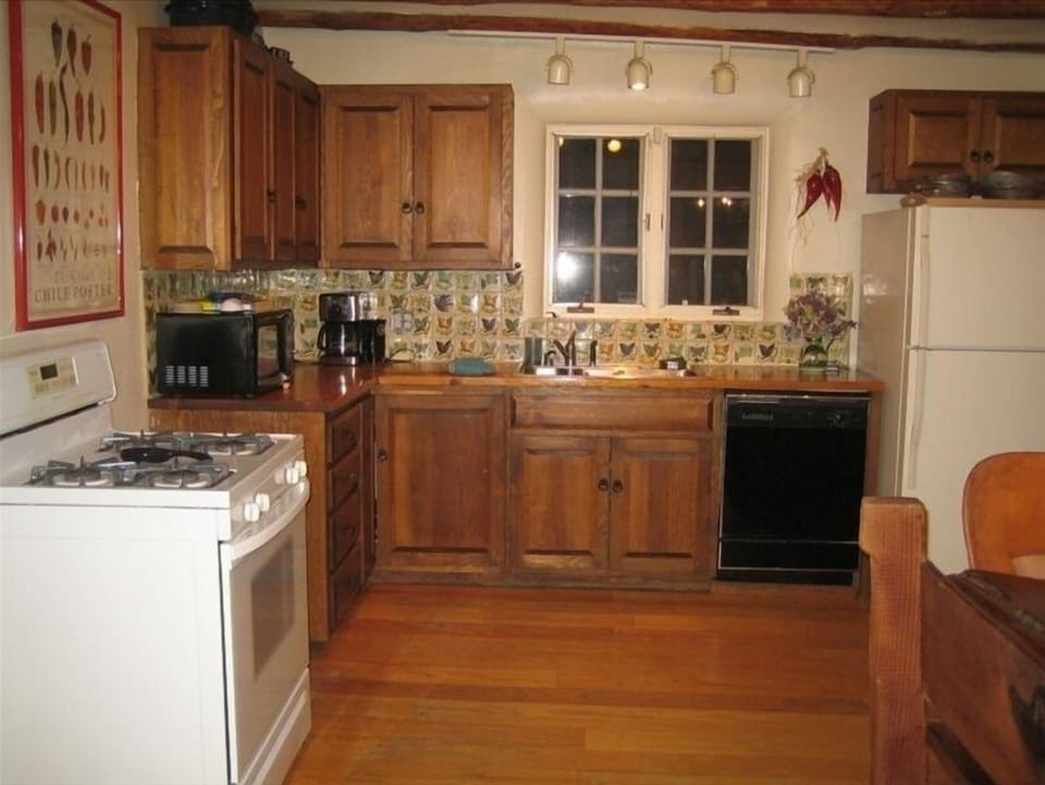 Spacious chef’s kitchen. Separate pantry with washer, dryer is off to right.