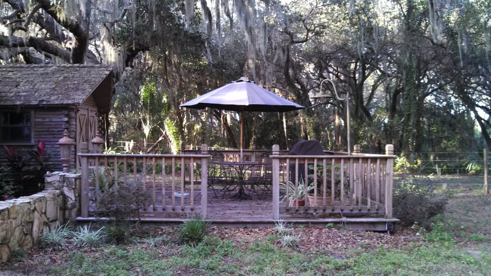 deck area with gas BBQ and washer-dryer room