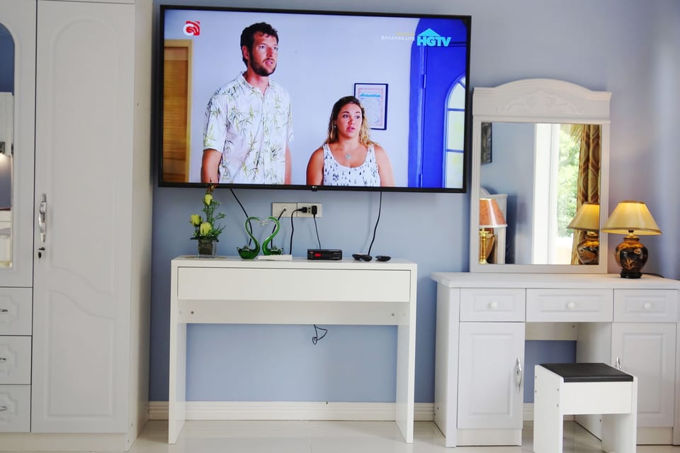 65 inch smart TV with hundreds of Cignal channels plus Netflix