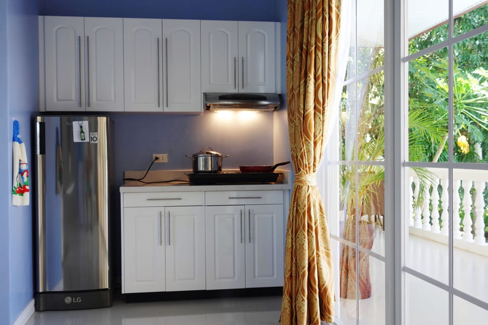 Your fully equipped and day-lit kitchen with big fridge.
