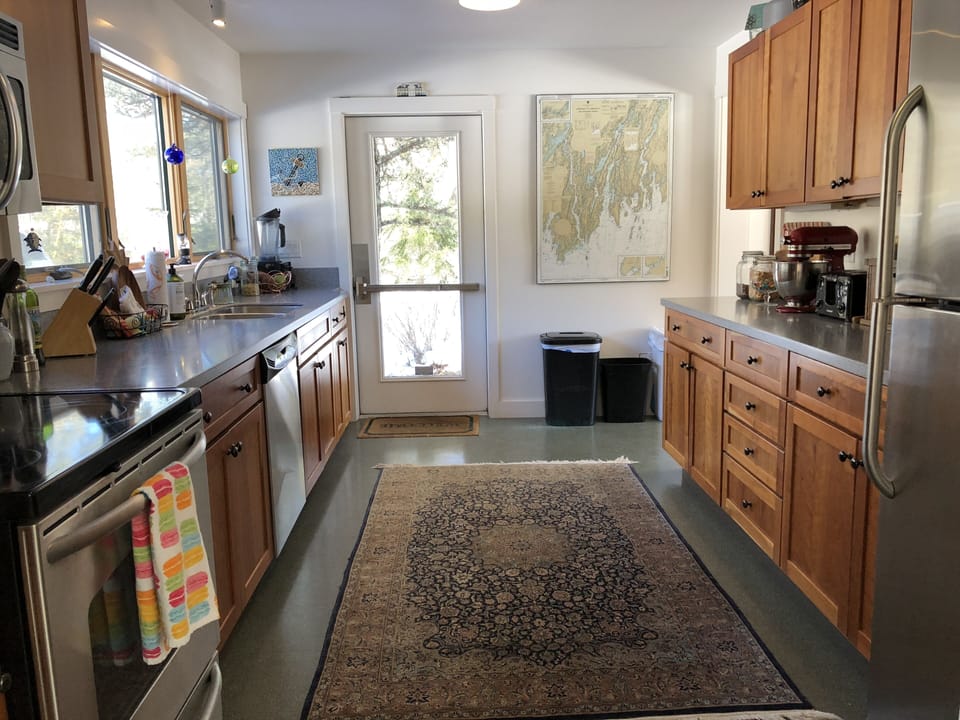 The galley kitchen is fully outfitted and has a full refrigerator also