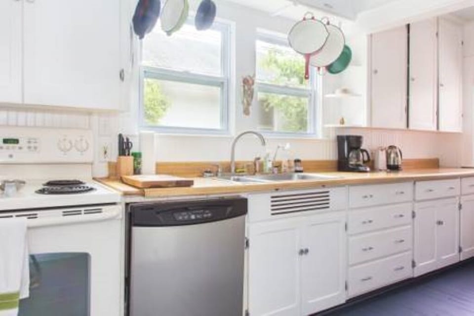 Cheerful kitchen with everything you need for cooking meals.