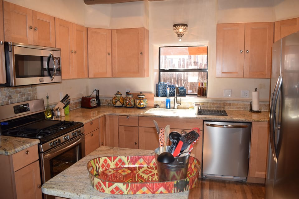 The new kitchen fully equipped. It has a gas stove, and all new appliances.