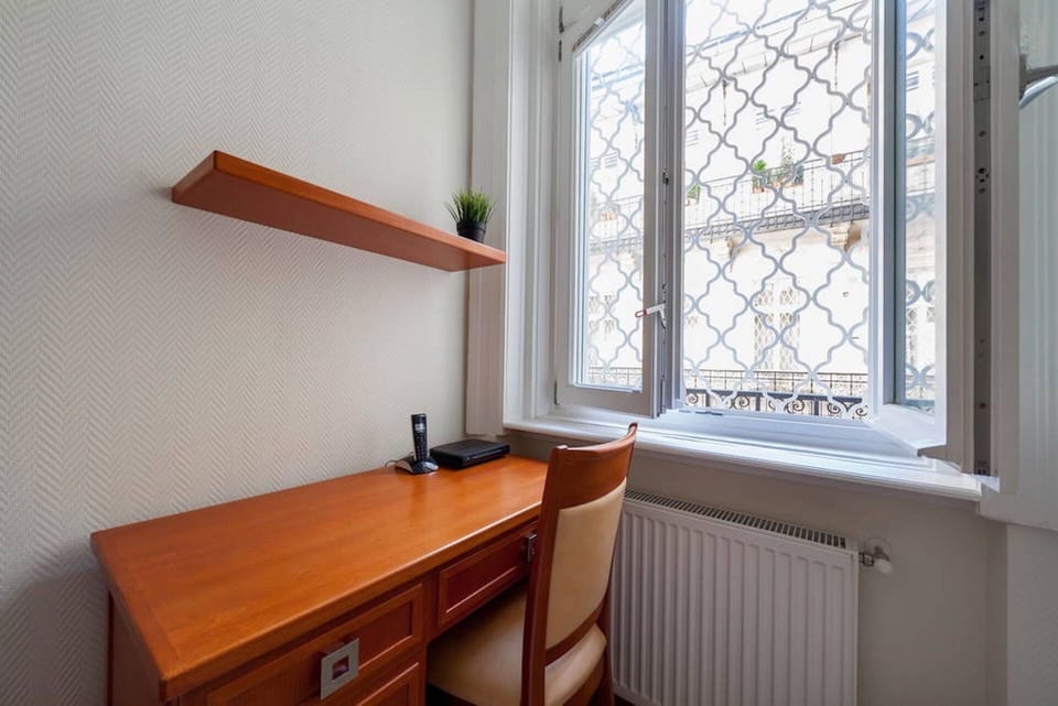 Bedroom desk, window over the beautiful court