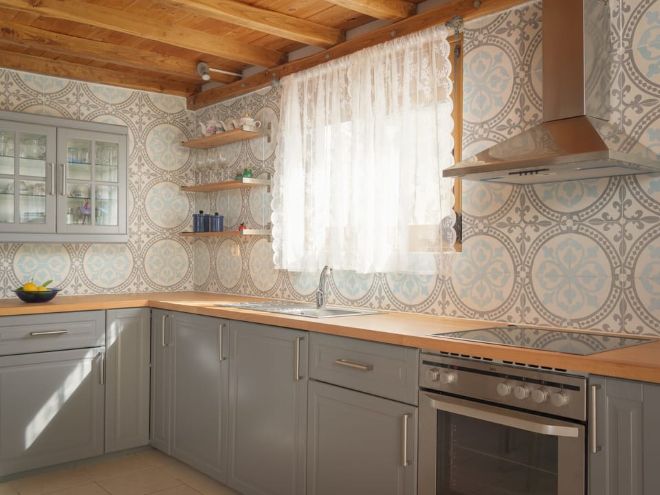 Take in the views whilst creating a supper at the bespoke kitchen.