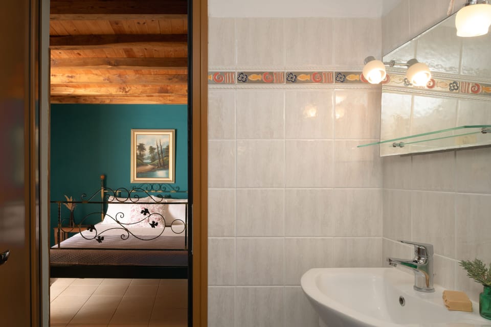 En-Suite Bathroom featuring a walk-in shower.
