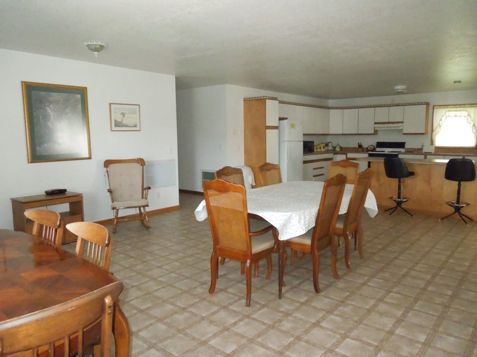 House Dining Room with 2 tables/chairs towards k
itchen