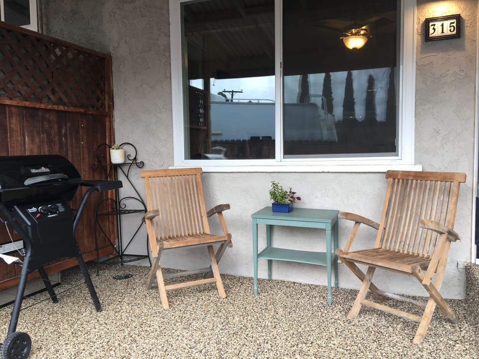 Front Private Patio Entry with Gas Bar b q and Seating 