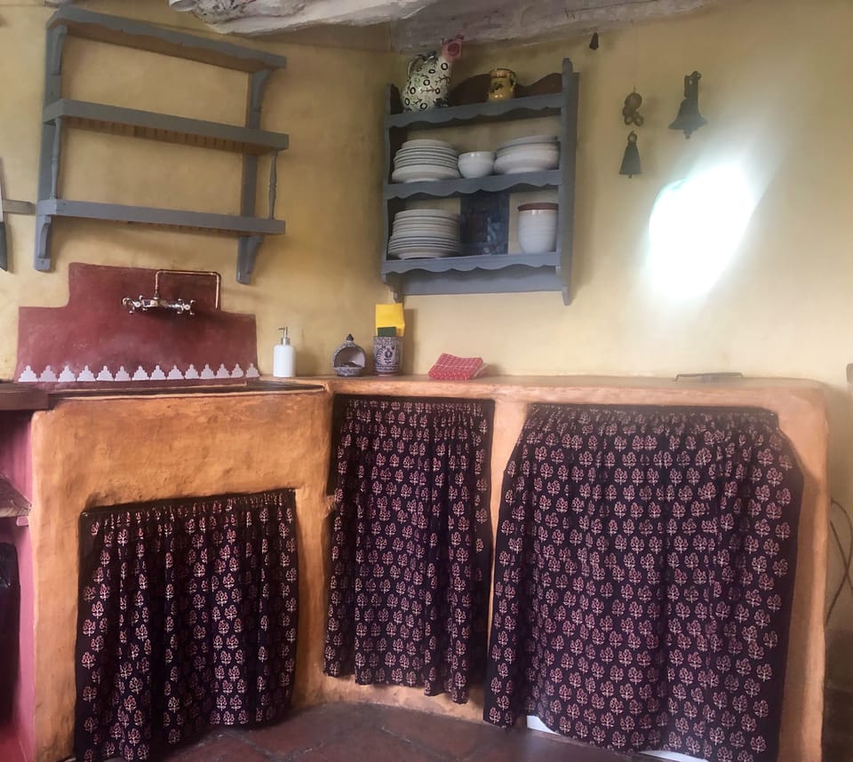 The yellow kitchen. It has all commodities, including dishwasher.