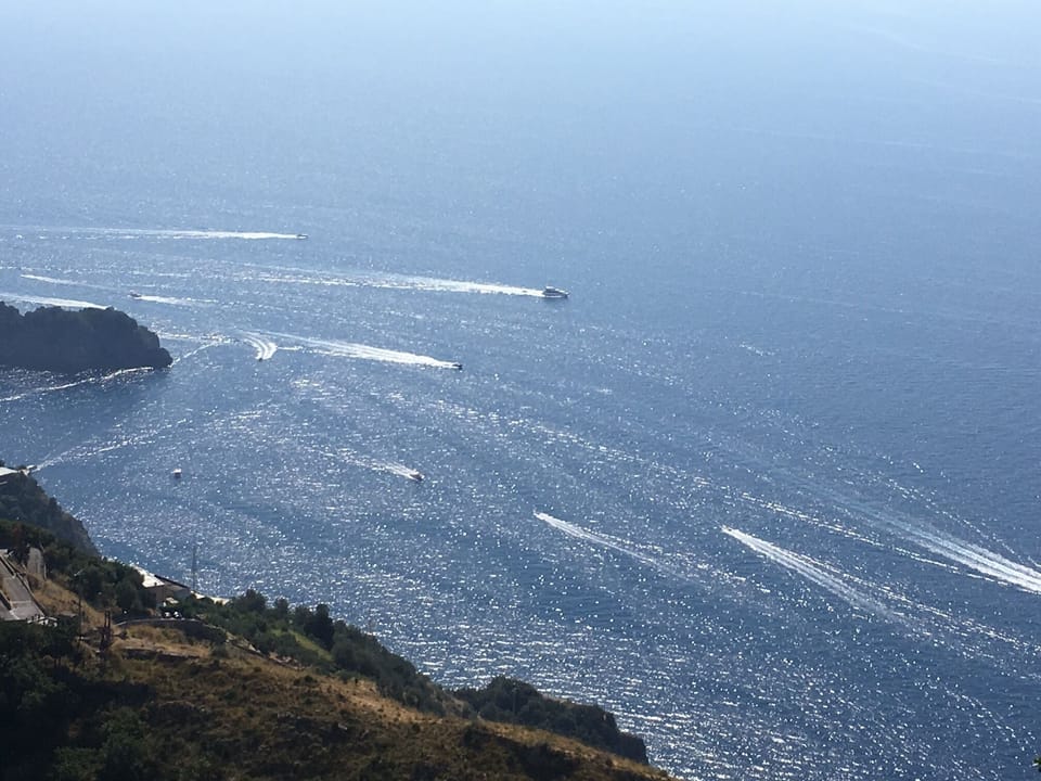 Enchanting view of the summertime sea filled with boats