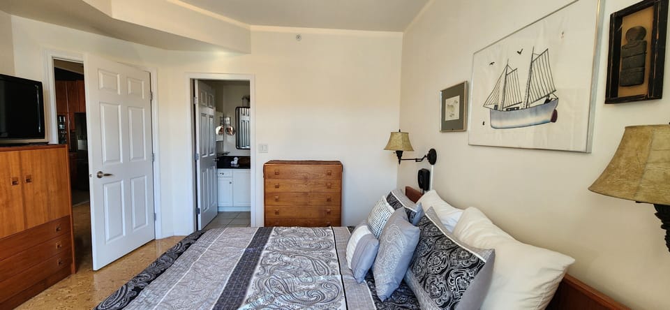 The master bedroom is complete with a queen sized bed and an ensuite bathroom. 
