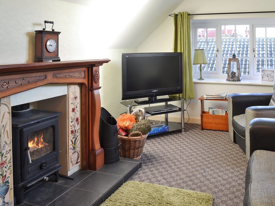 Cosy and warm living room with wood burner | Holbeck Apartment, Scarborough