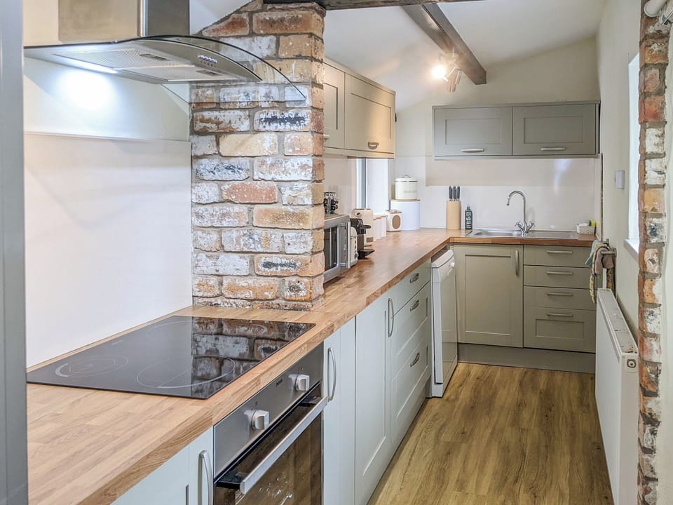 Well appointed galley style kitchen | Seascape Cottage, Allonby, near Maryport
