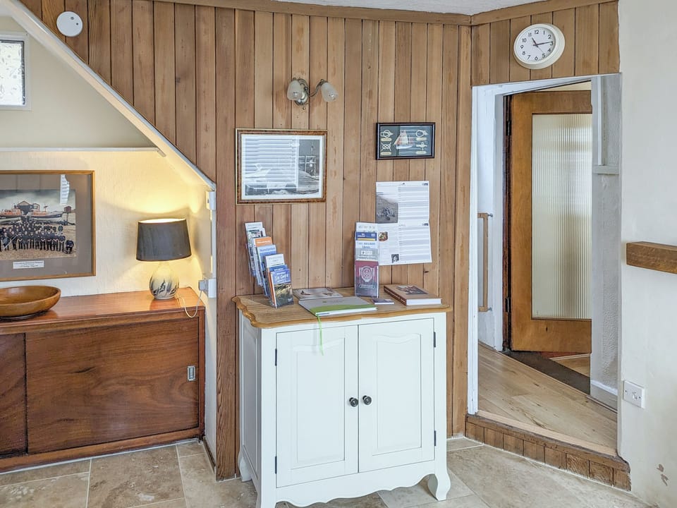 Dining room with tourist information | Trinity Cottage, Wells-next-the-Sea