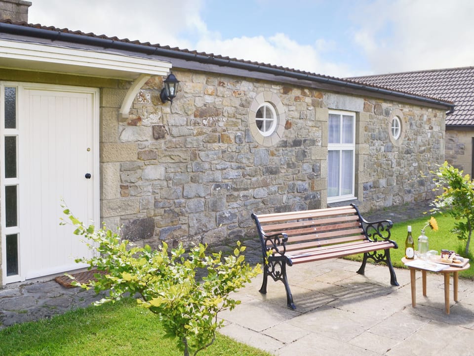 Paved patio area with outdoor furniture | Lapwing Cottage - High Weldon Cottages, Weldon Bridge, near Rothbury