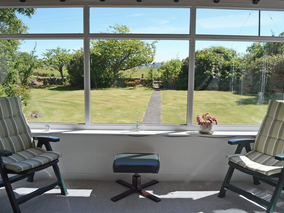 Relaxing sun room with garden views | Old Midoxgate Farmhouse, Midoxgate, near Tain