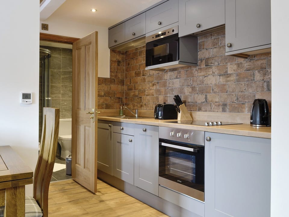 Well-equipped fitted kitchen | The Byres Tethera - Stone House Farm Holiday Cottages, St Bees, near Whitehaven