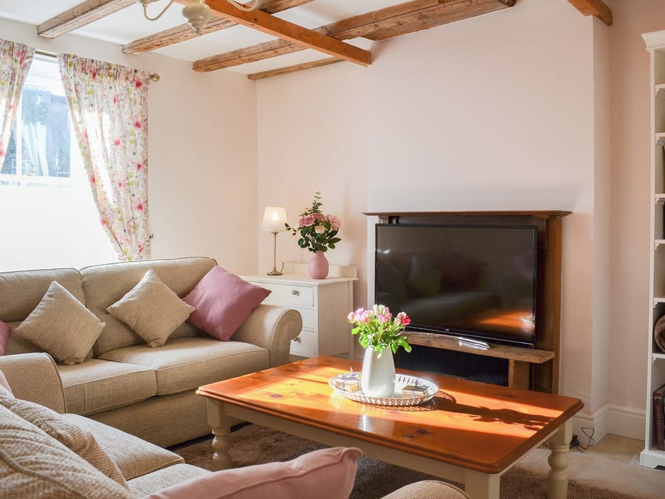 Charming beamed living room | West House Farm, Muston, near Filey