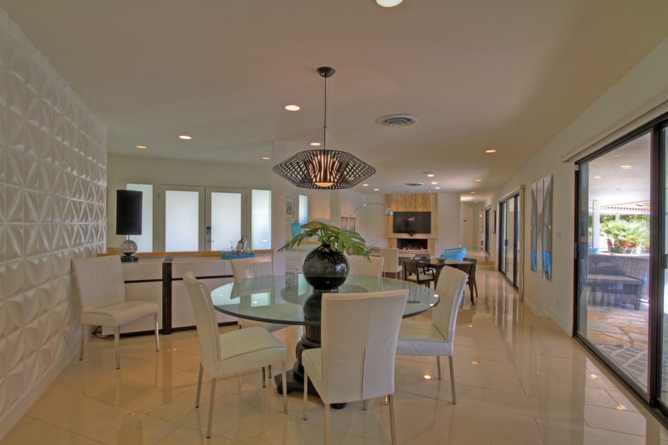 Dining Room, seats 6-8, with unique accent wall capturing the mid-century decor.